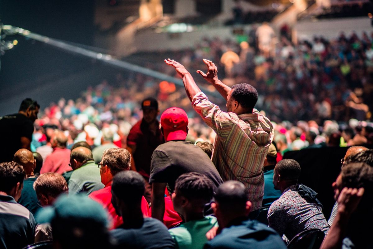 Better Man event, man worshipping in the crowd